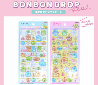 Sumikko Gurashi Bonbon Drop Stickers featuring Blue and Pink designs from San-X, showcasing puffy candy-like glossy textures and adorable kawaii characters loved by stationery fans.