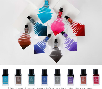 Close-up of 8 sparkling J. Herbin Anniversary Ink mini bottles with gold particles, perfect for fountain pens, journaling, testing ink colors, or gifting stationery lovers.