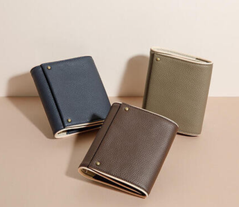 KNOX mini system notebook in Brown, Taupe, and Navy with compact, elegant design, magnetic closure, pen sleeve, and furoshiki-inspired wrap for journaling and daily use.