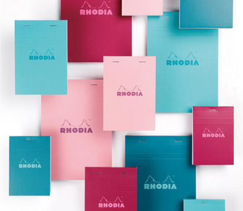 Rhodia Bloc Memo COULEURS collection featuring turquoise, blue, plum, and pink memo pads with smooth writing paper and colorful grid lines for stylish note-taking.