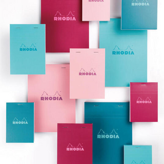 Rhodia Bloc Memo COULEURS collection featuring turquoise, blue, plum, and pink memo pads with smooth writing paper and colorful grid lines for stylish note-taking.