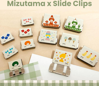 Close-up of mizutama collaboration slide clips featuring cute illustrated designs by mizutama, available in two sizes for organizing papers, planners, and snacks.