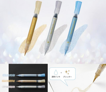 Pentel Starflake Brush Pen in gold, silver, and blue shades, a limited edition glitter brush pen that adds sparkle to journaling, calligraphy, and creative stationery projects.