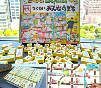 A colorful Japanese stamp kit called “Hanko Petapeta, Let’s Build Our Town,” featuring 77 stamps, play sheets, and stickers for kids and adults to create their own mini town maps.